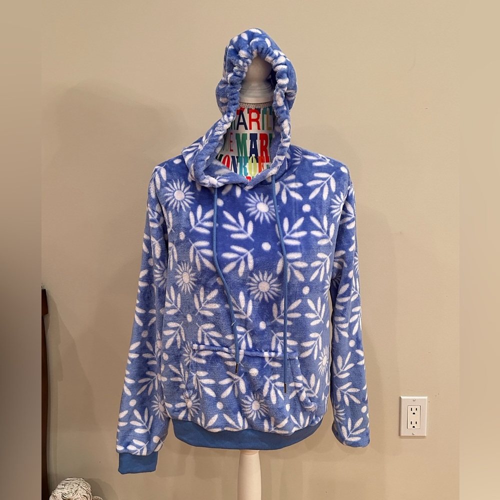 Free Haven blue and white print hoodie with kangaroo pocket. Size medium.